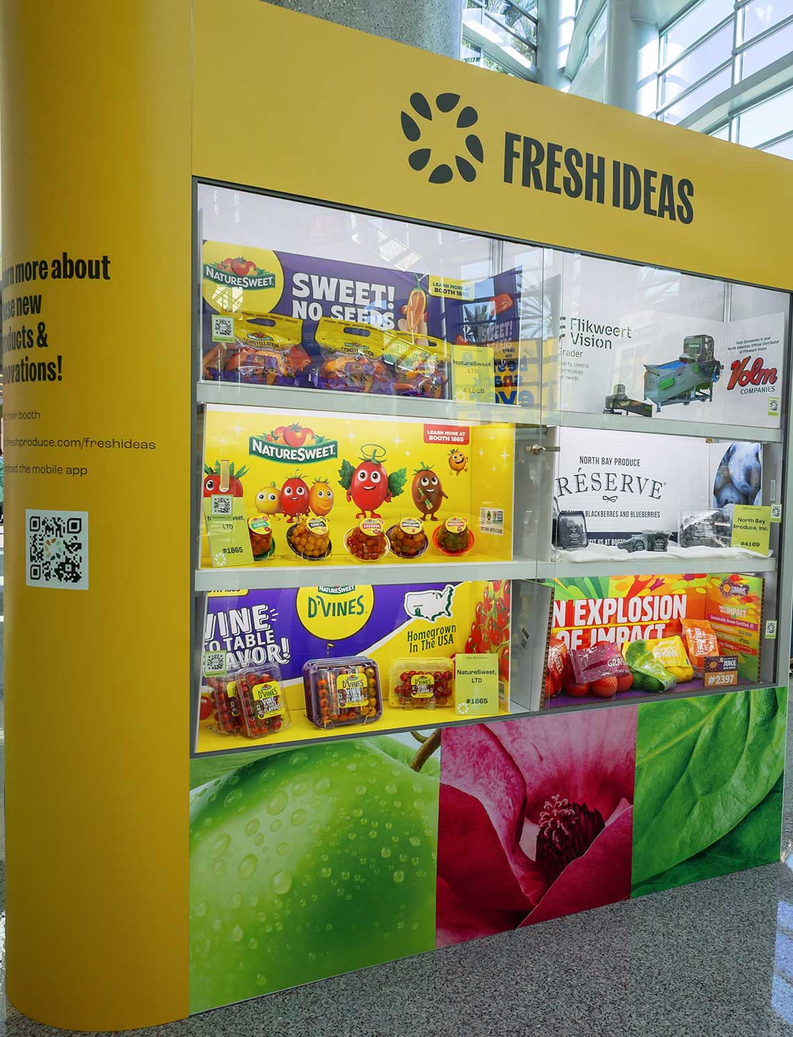 A display labeled "Fresh Ideas" showcasing produce packaging with colorful graphics and brand names.