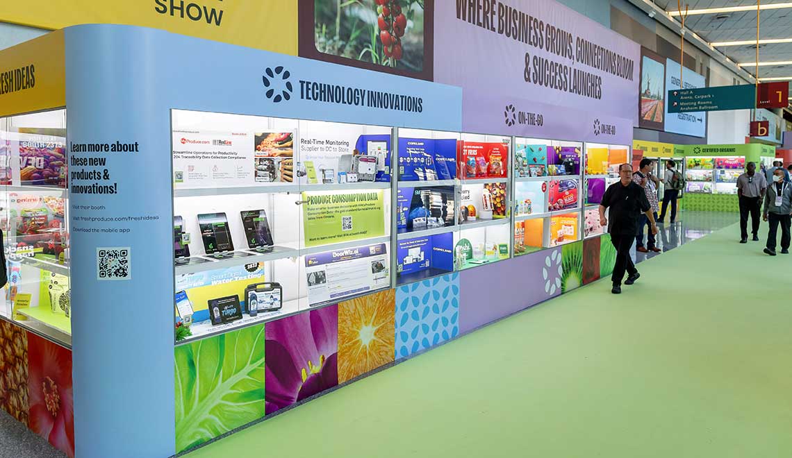 Trade show with booths showcasing technology innovations and products.